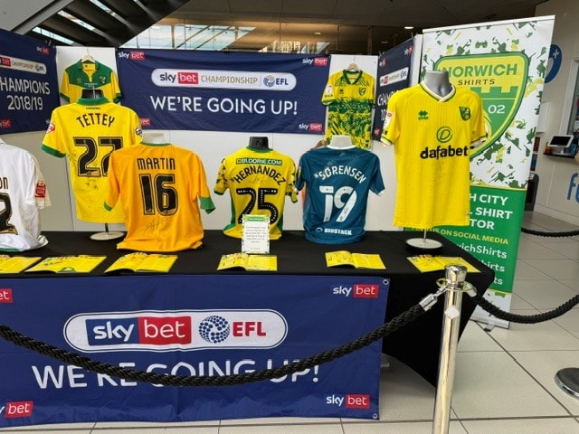 Norwich Shirts Sky Bet Championship stand with signed match-worn shirts at the March 2025 Football Collectors Fair