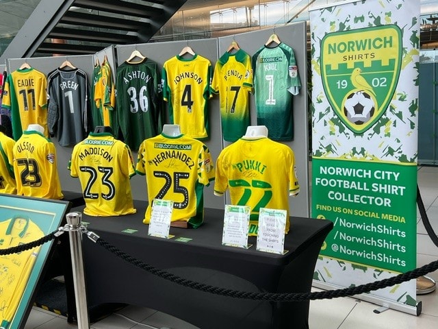 Visitors browsing football memorabilia stalls at the March 2025 Football Collectors Fair, The Forum Norwich