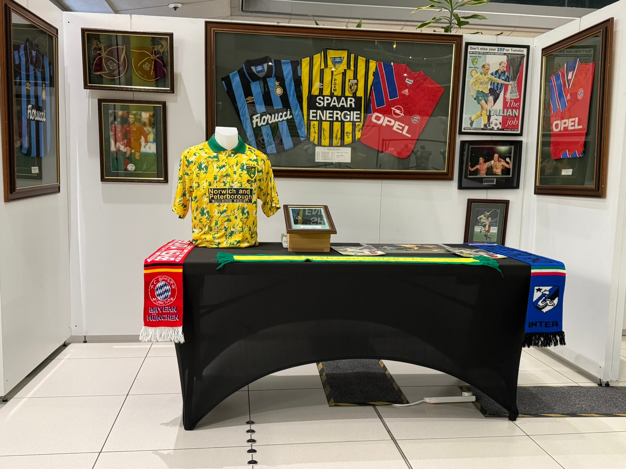 Framed football memorabilia and vintage shirts at the March 2026 Collectors Fair
